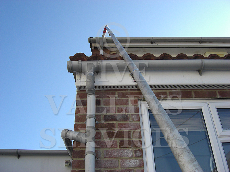 Our pole up to a high gutter on a brick house