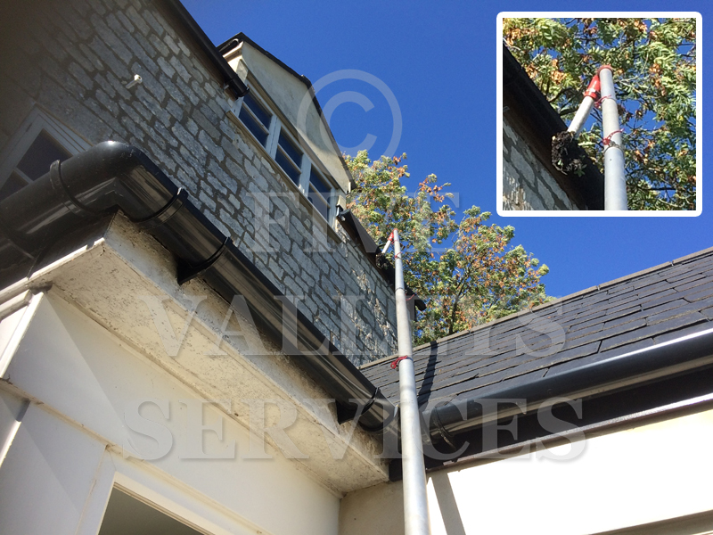 Clearing a high gutter above a white porch