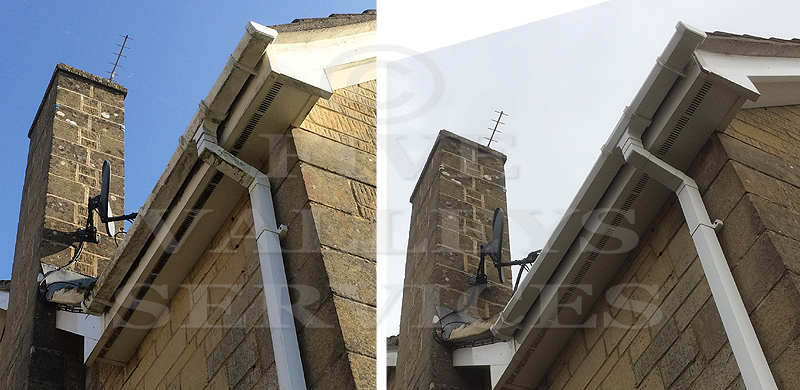 A fascia and downpipe by a stone chimney, before and after