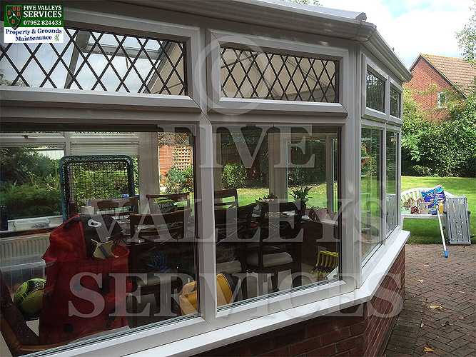 The side of a conservatory with leaded lights